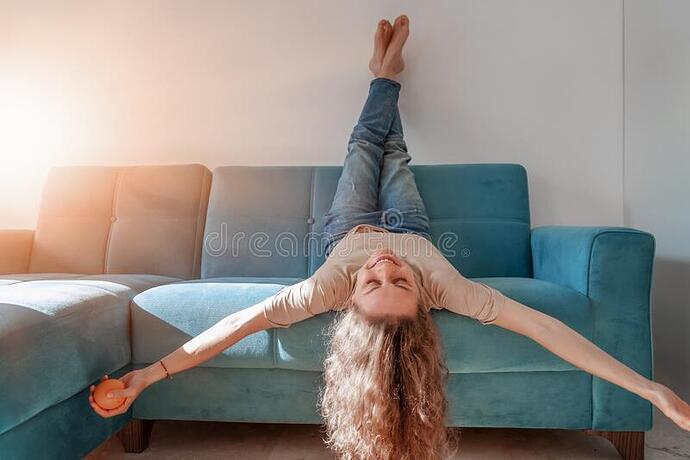 portrait-lovely-cheerful-cheery-curly-girl-having-fun-lying-blue-sofa-head-upside-down-happy-free-lifestyle-concept-179421580